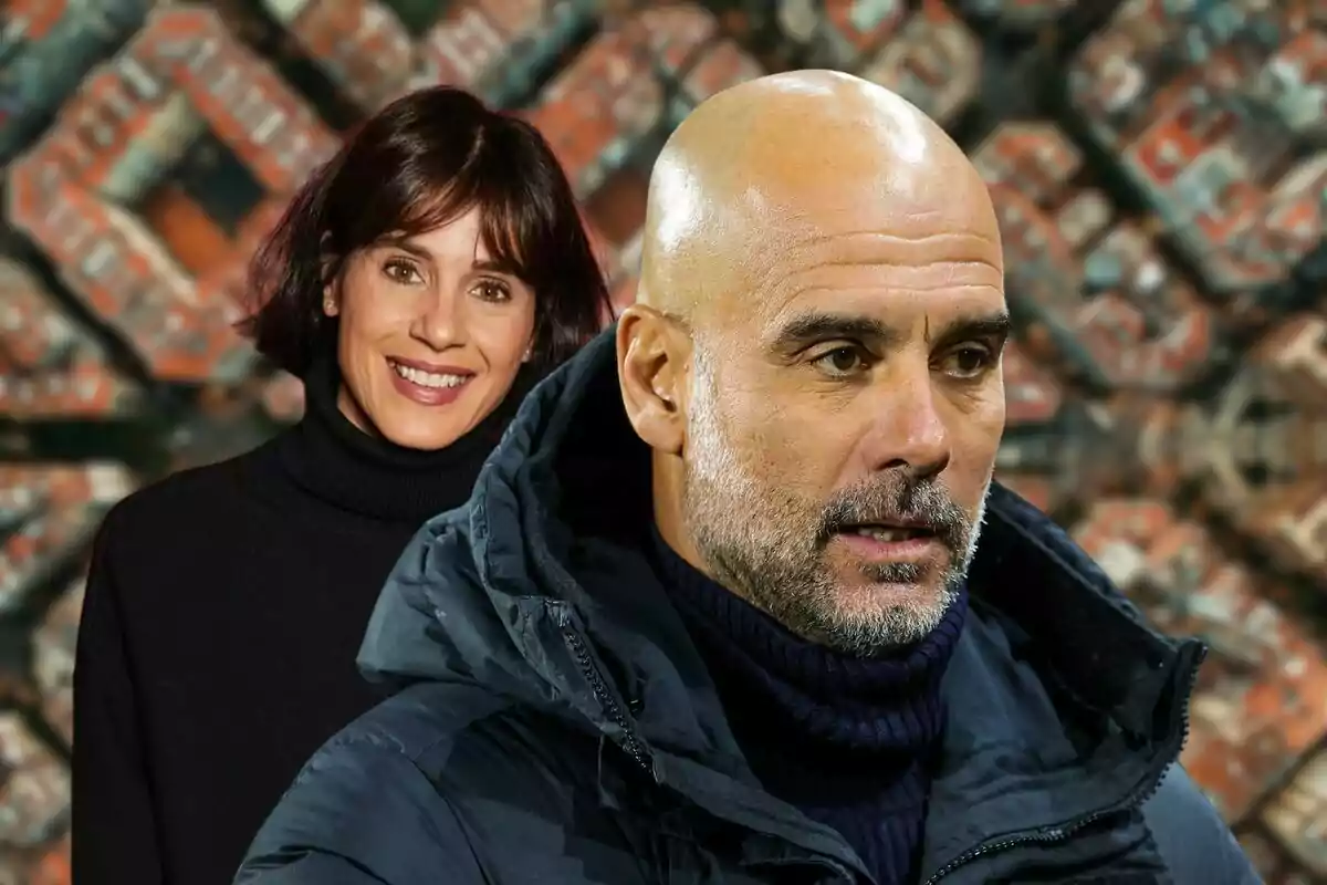 Two people pose in front of a blurred urban background.