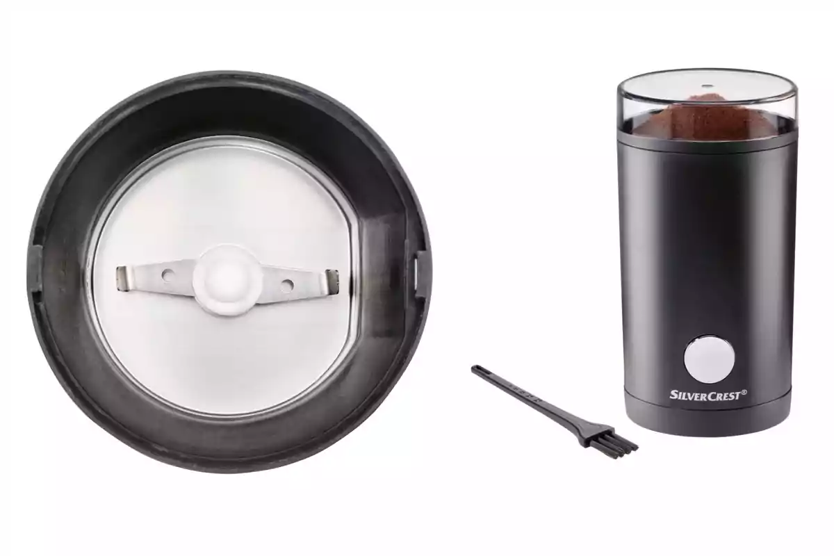 Black electric coffee grinder from Lidl with a transparent lid, stainless steel blades, and a small cleaning brush. Black electric coffee grinder from Lidl with a transparent lid, stainless steel blades, and a small cleaning brush.