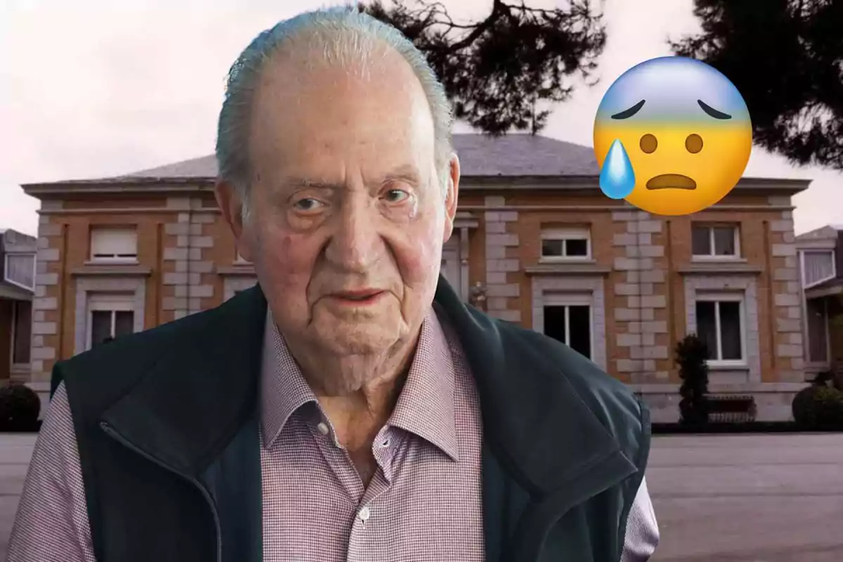Juan Carlos I in front of a building with a worried face emoji and a sweat drop.